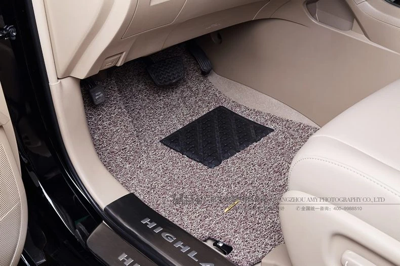 light beige coil driver mat fitted in a cream footwell