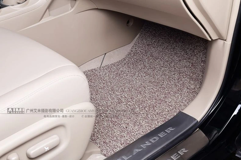 beige speckled coil passenger mat fitted around the transmission tunnel