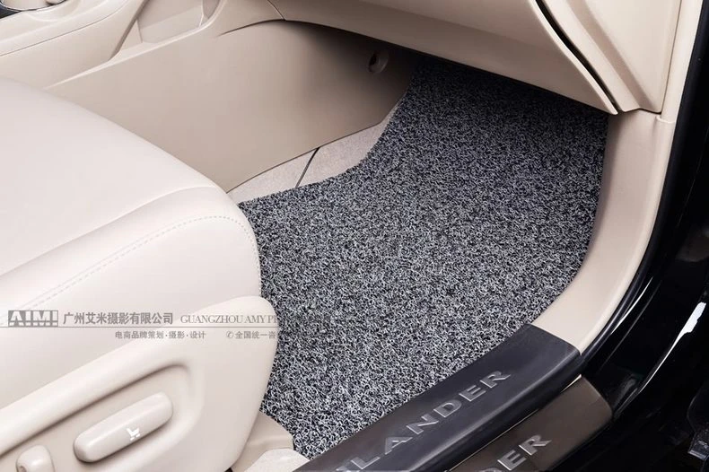 passenger footwell coil mat close-up showing edge binding