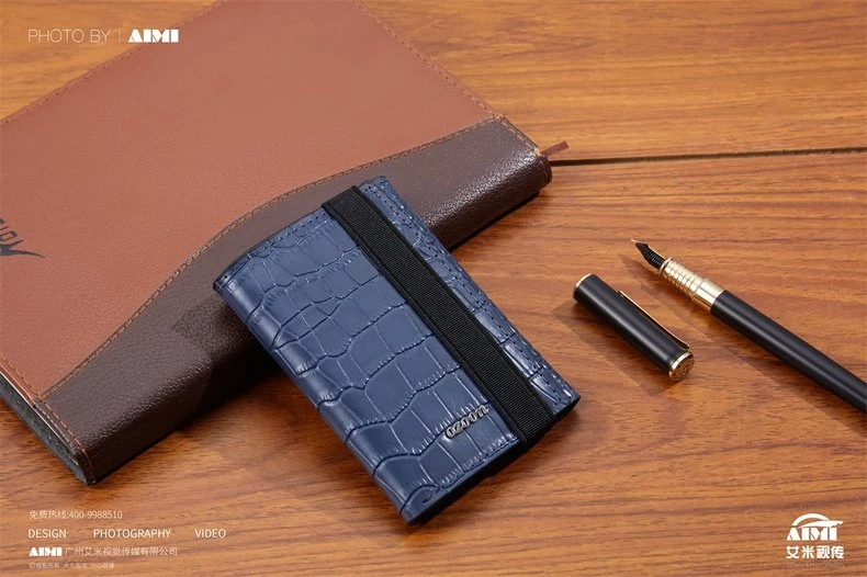 Navy croc-embossed card holder with notebook and fountain pen - executive styled photography