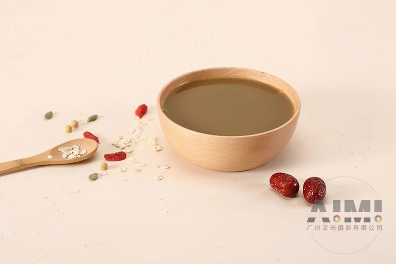 Prepared grain gruel bowl with jujube and oat props on cream
