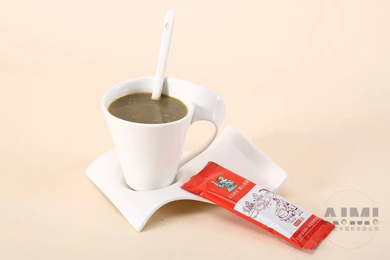 Wellness grain sachet with the brewed grain drink in a sculpted mug