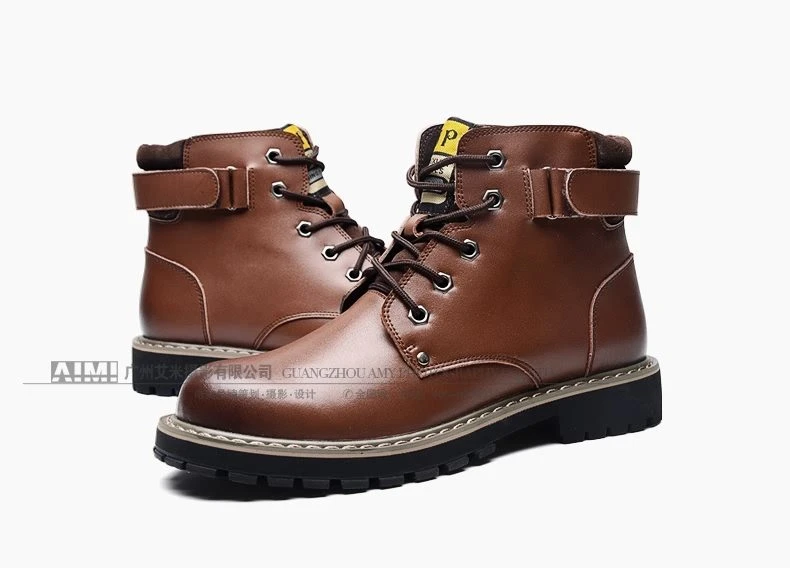 Brown leather work boots with contrast welt stitching, paired three-quarter packshot on white