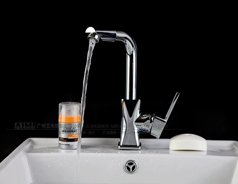 Stainless steel faucet photography gray background wall creative photography perfect shooting effect lifestyle scene photography