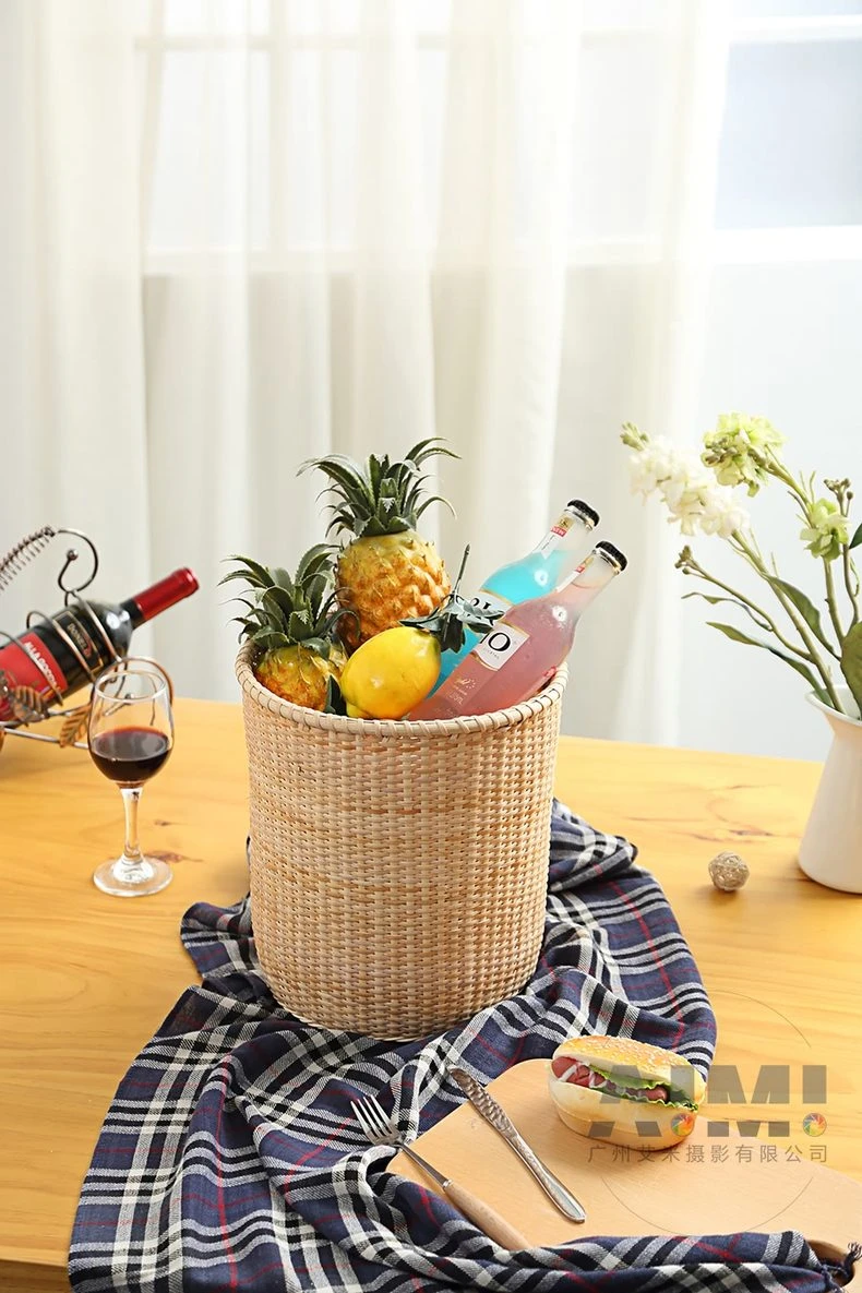 Woven basket with pineapples drinks and burger board on plaid cloth - rattan picnic photography