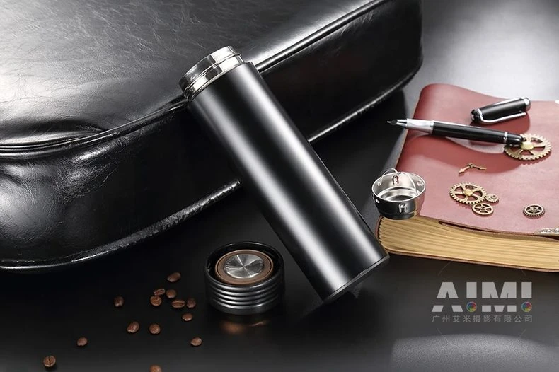 Black flask with journal gears and fountain pen - executive thermos photography